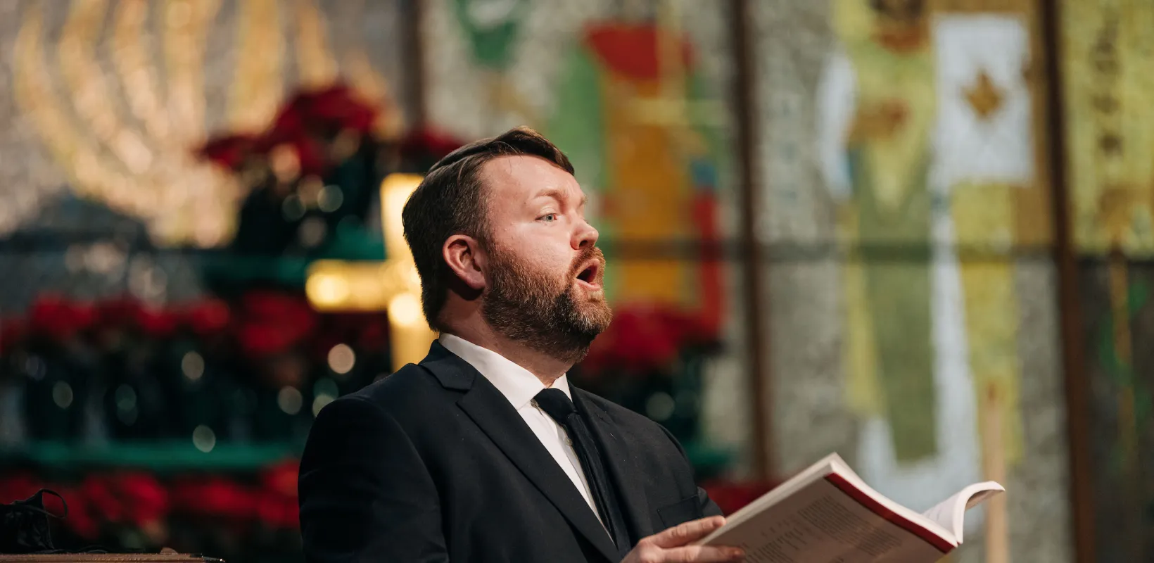 man singing in church