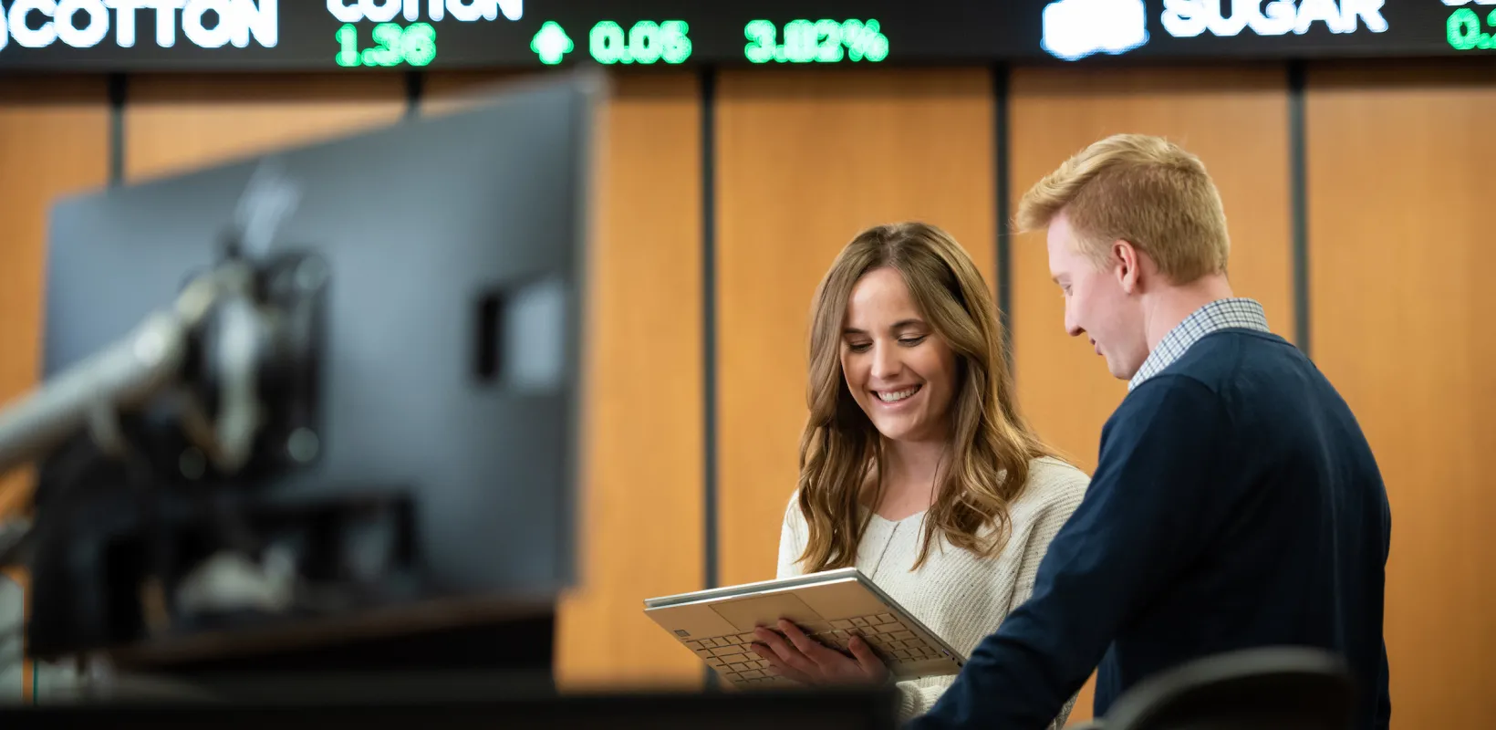 Two people following the stock market