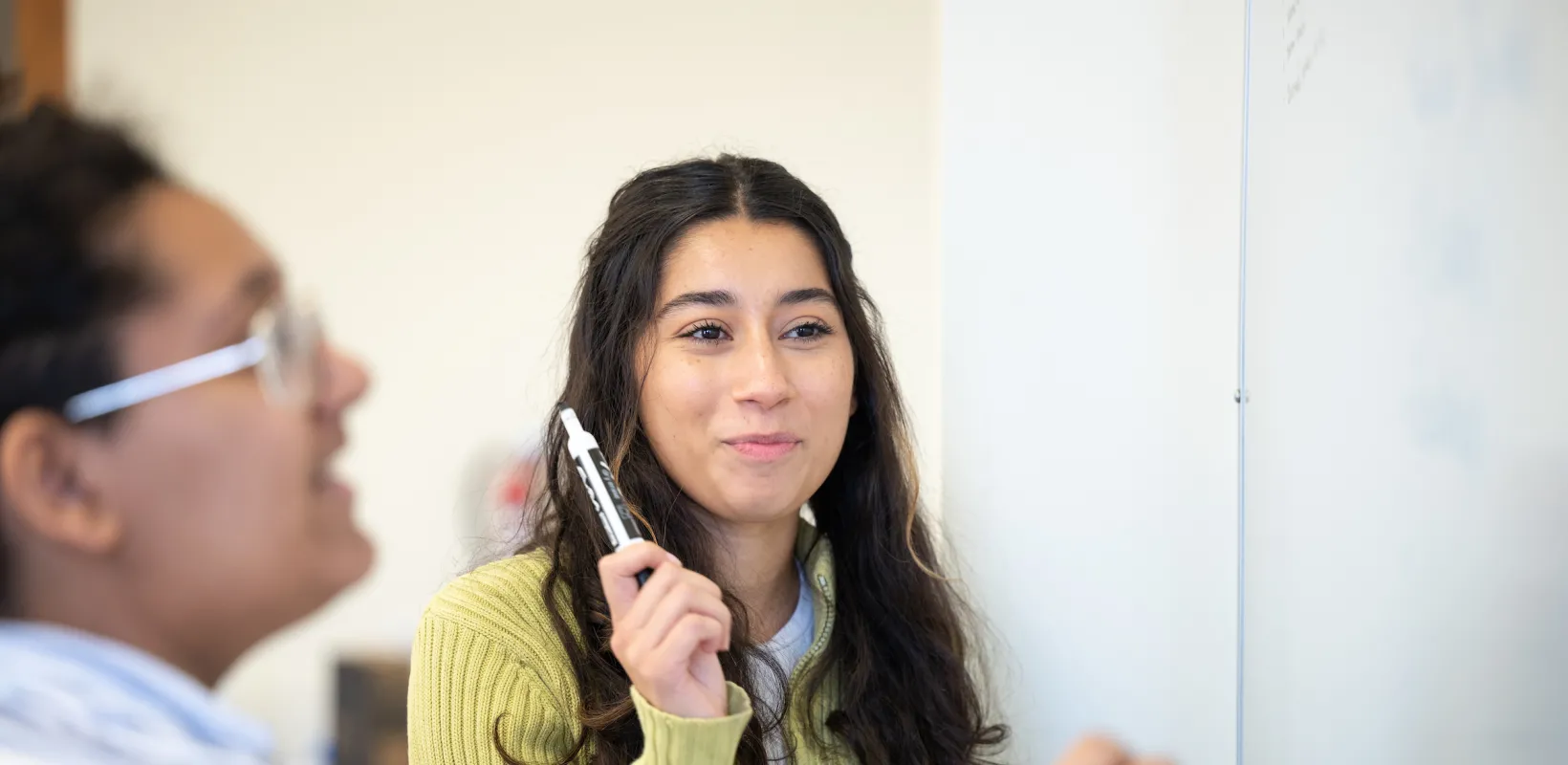students working at a white board