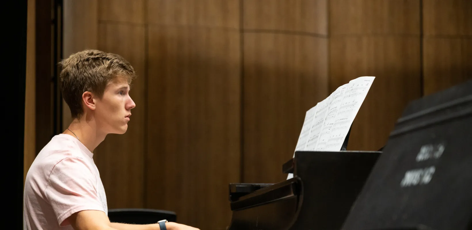 student playing a piano