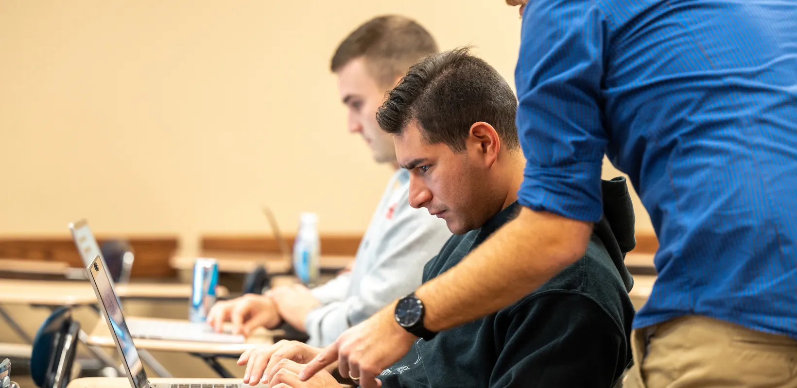professor helping a student in class