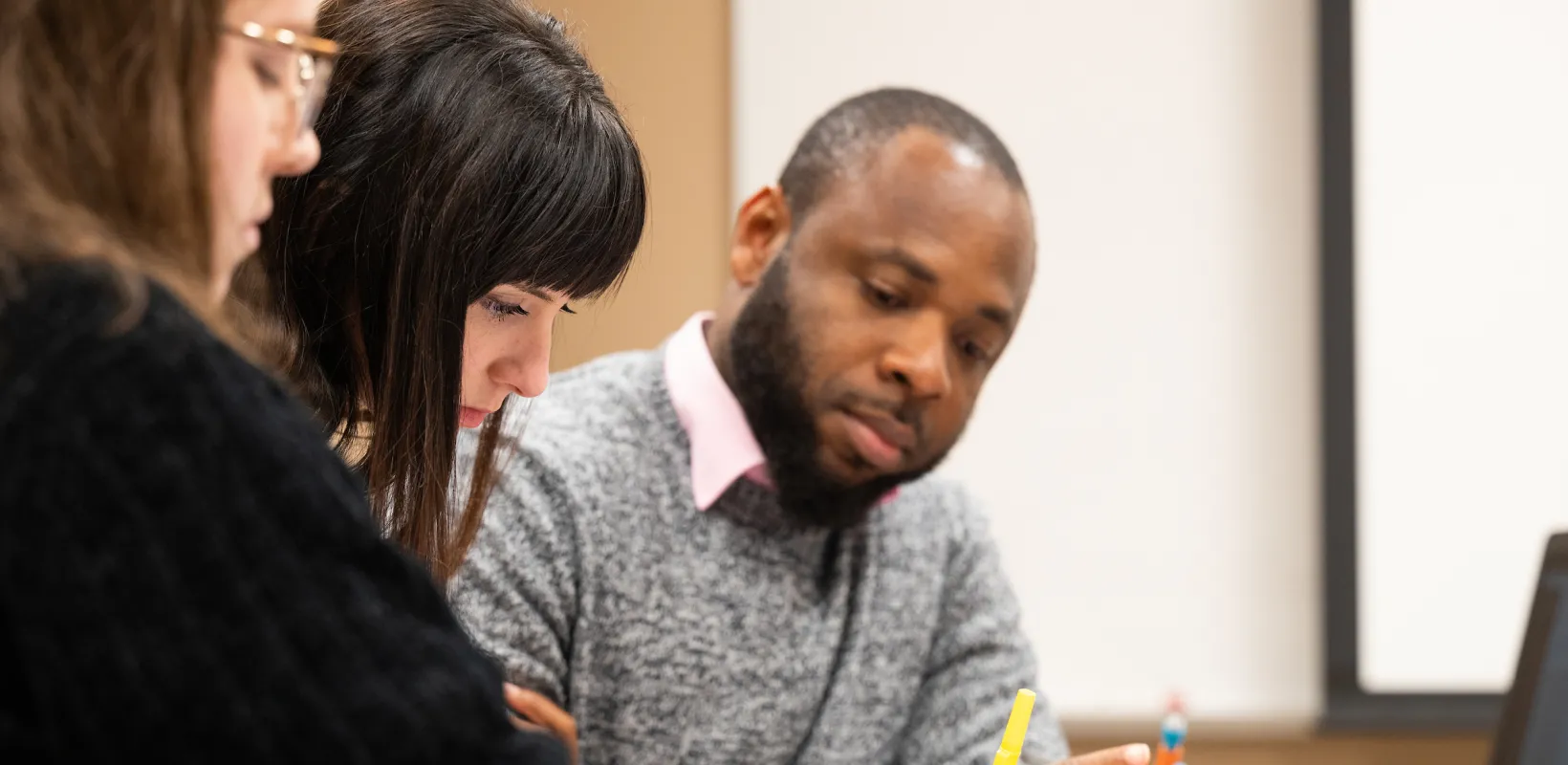 students working on an assignment in class