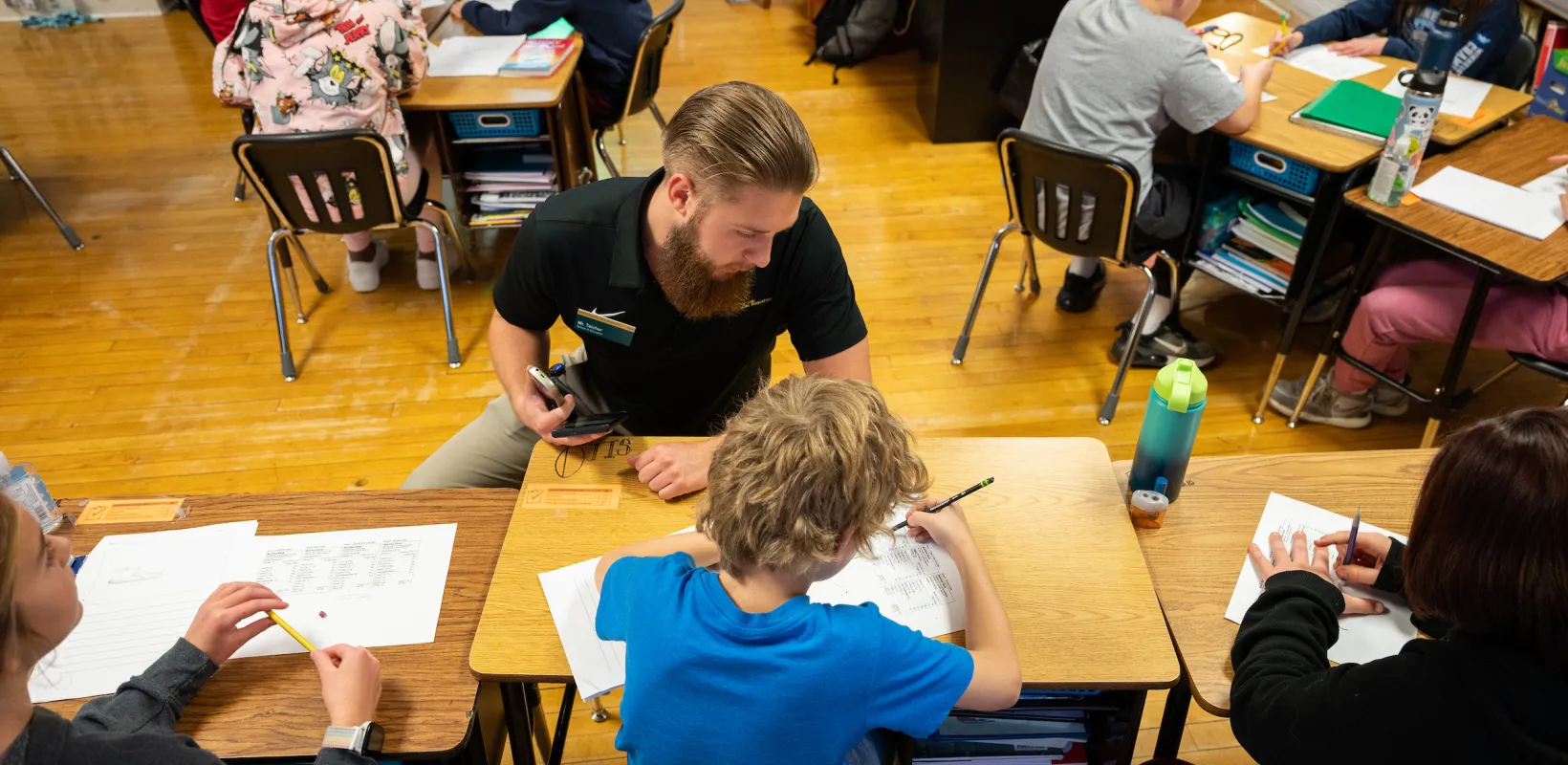 staff teaching children in a classroom