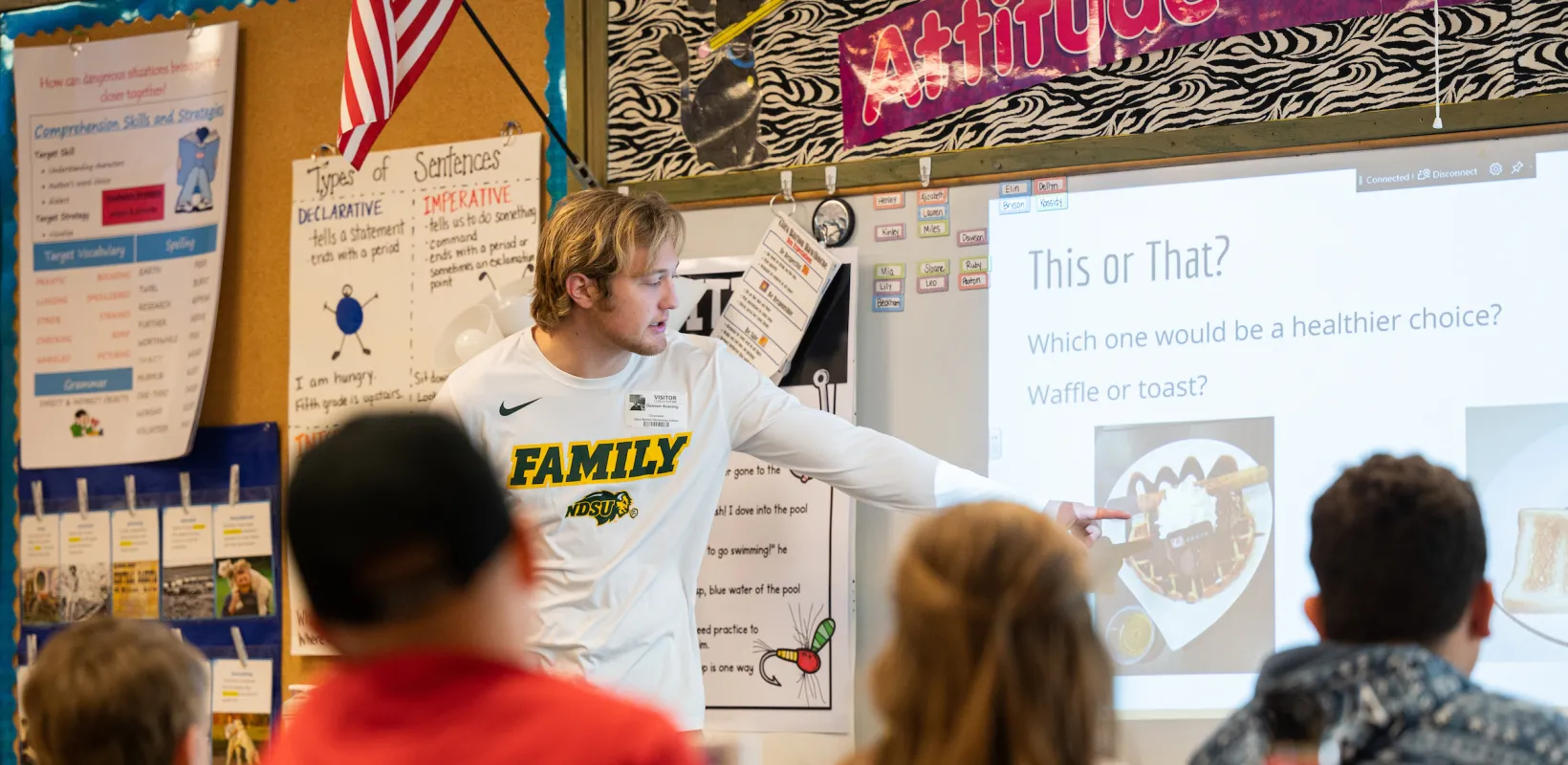 student making a presentation in front of a class
