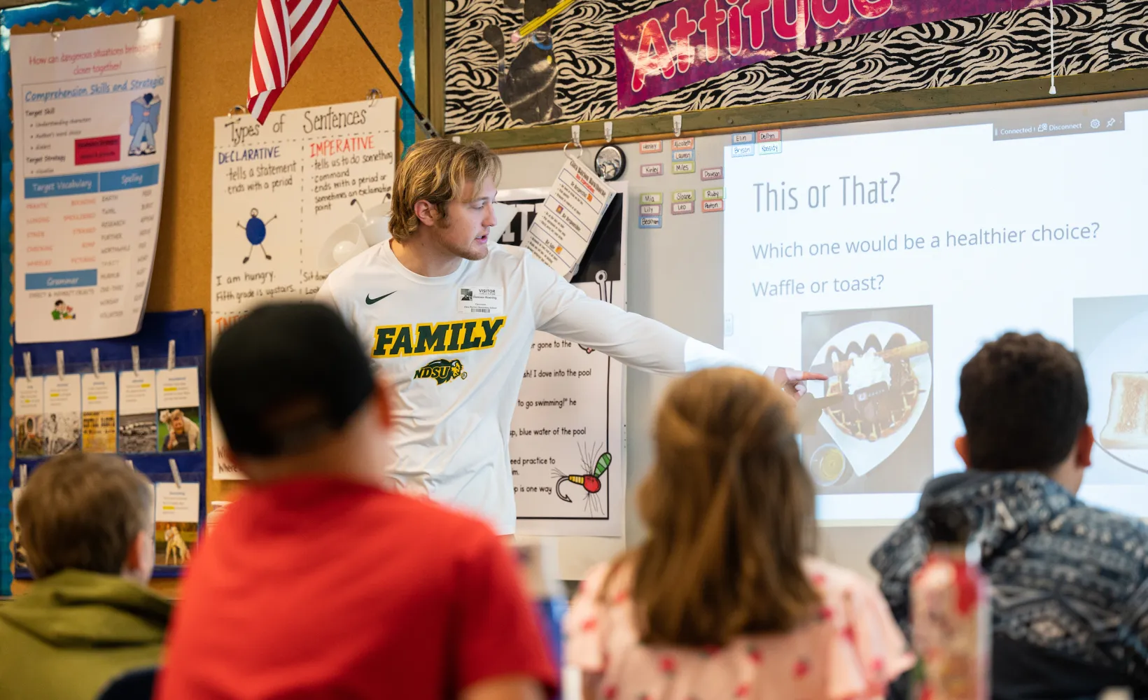 Health Education student giving a presentation to a classroom of young students