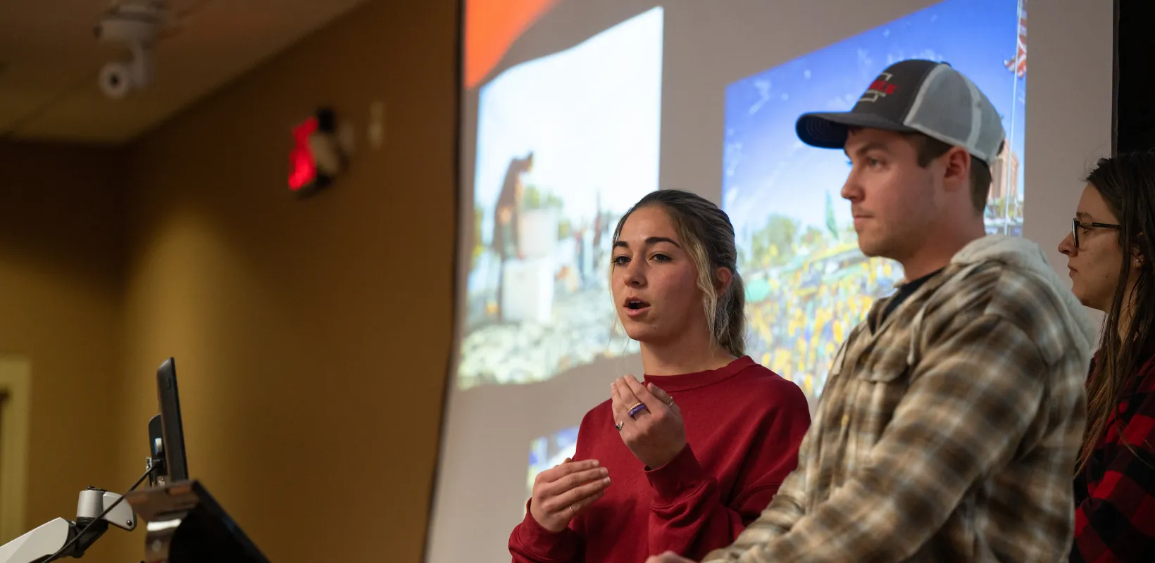 students speaking during a presentation