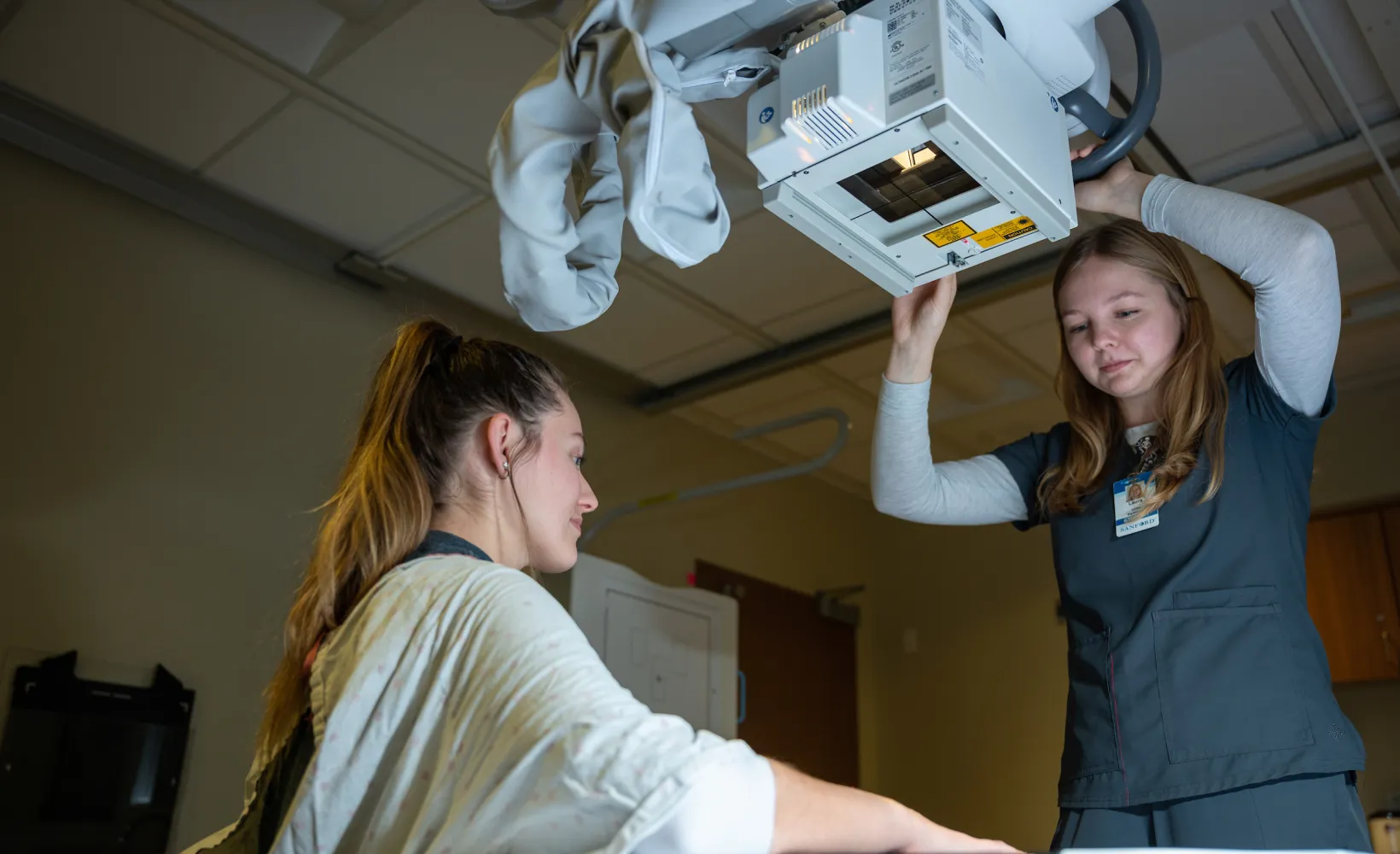 Radiologic Science student taking an x-ray during class