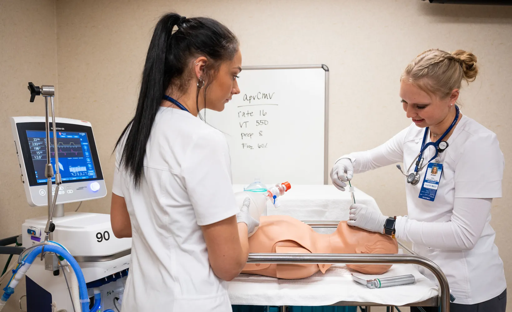 Respiratory Care students practicing procedures on a mannequin