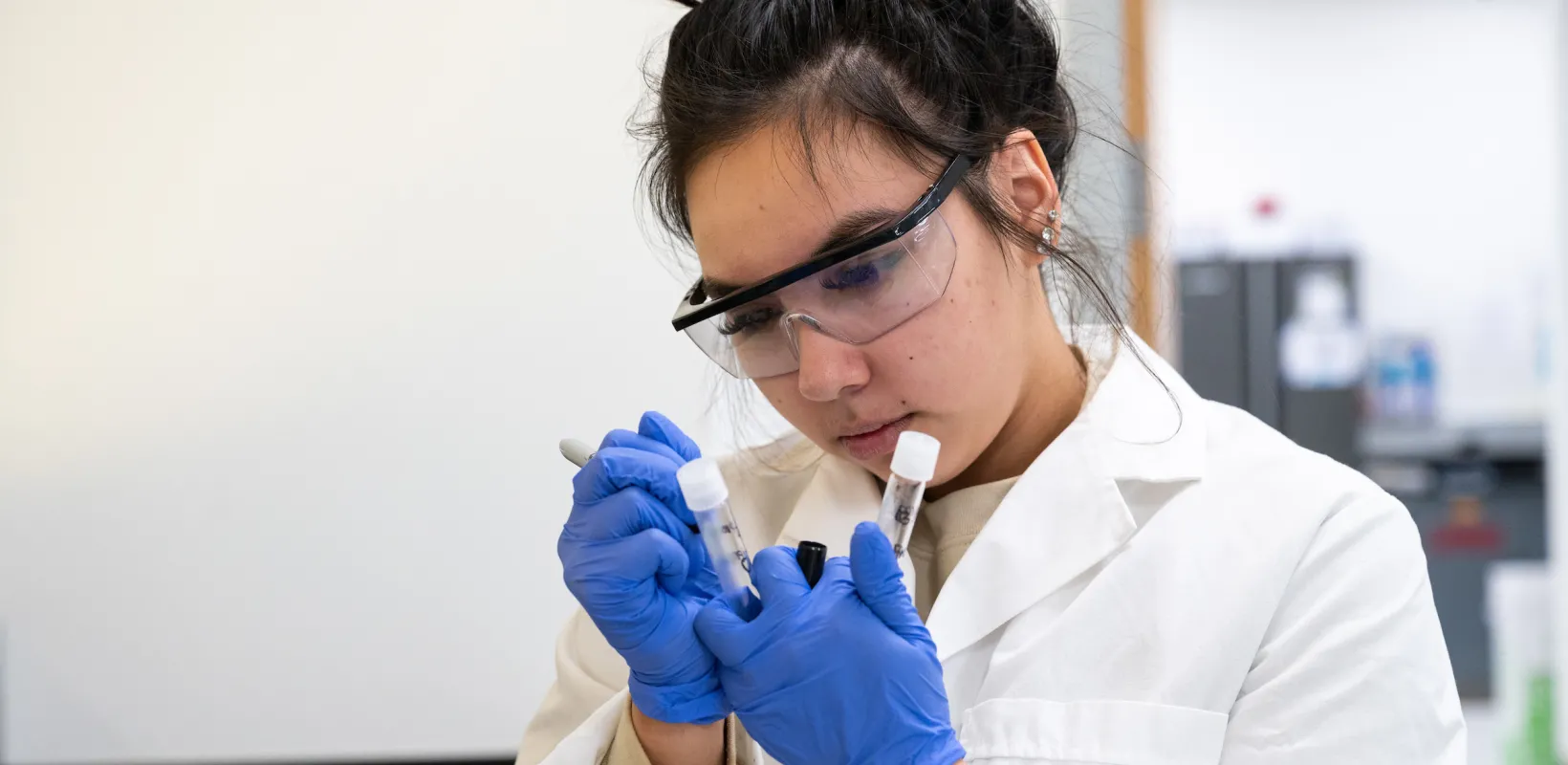 student working with samples in a lab