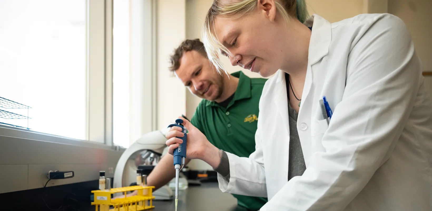 students filling a lab tray