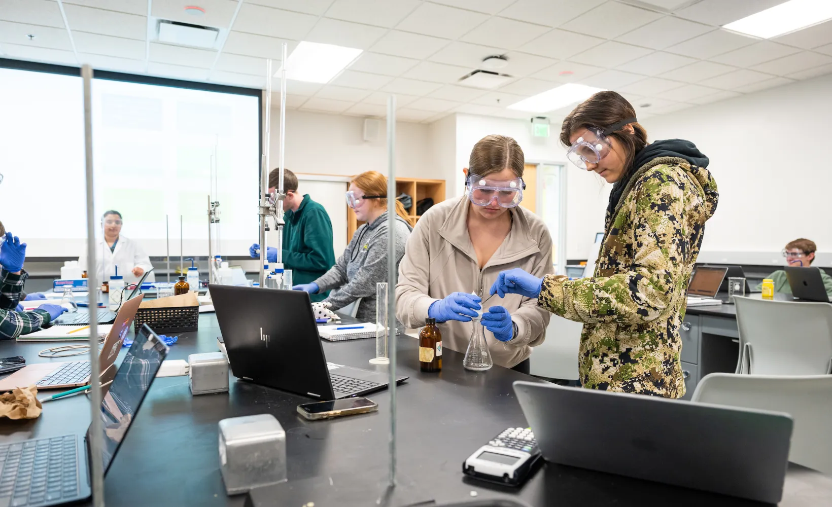 students performing experiments in a lab