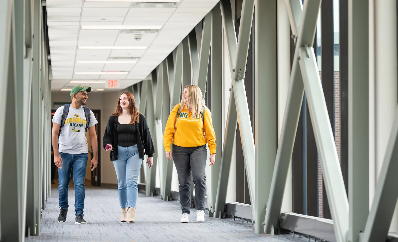 grad students walking through campus building