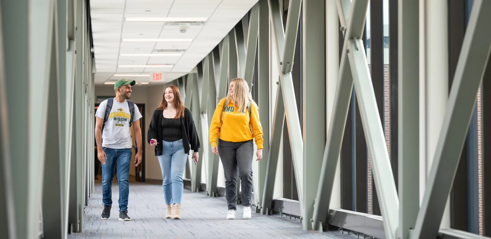 grad students walking through campus building