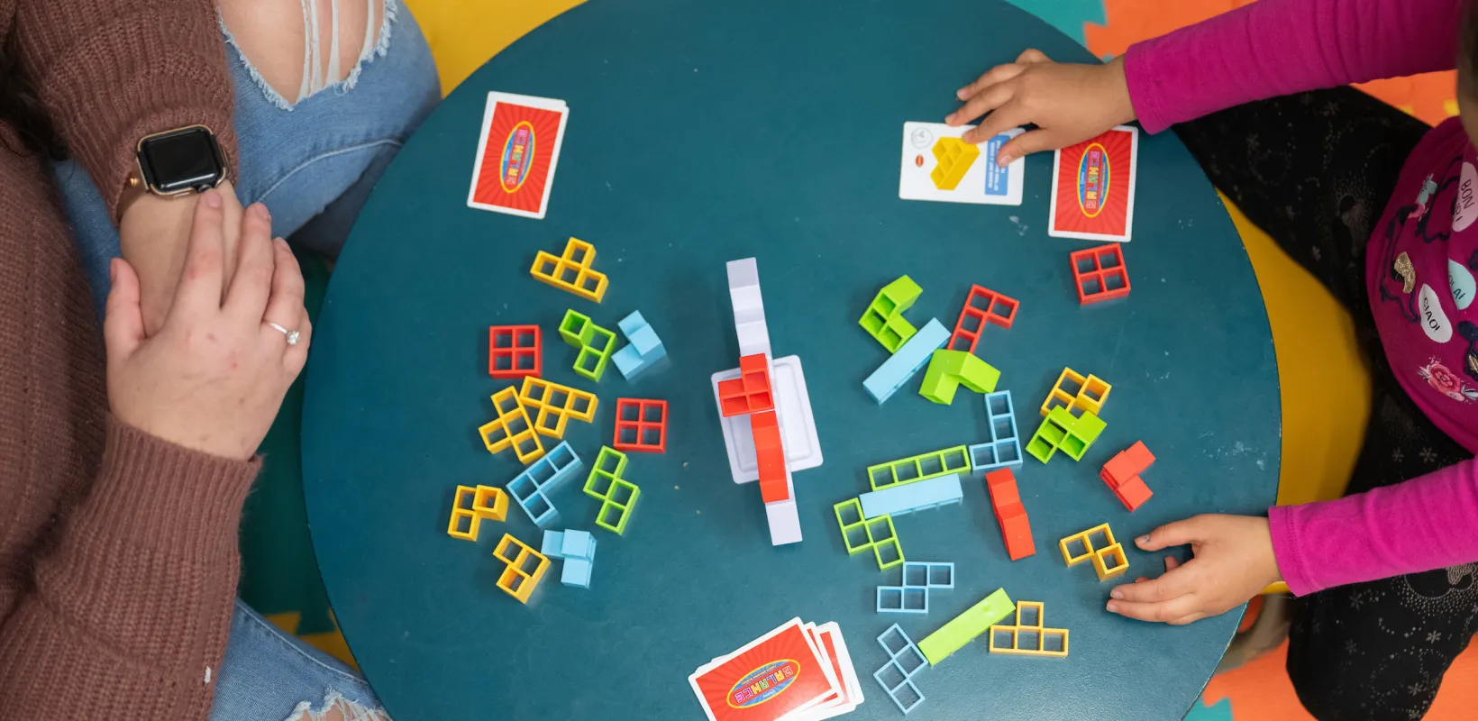 student playing a game with a child