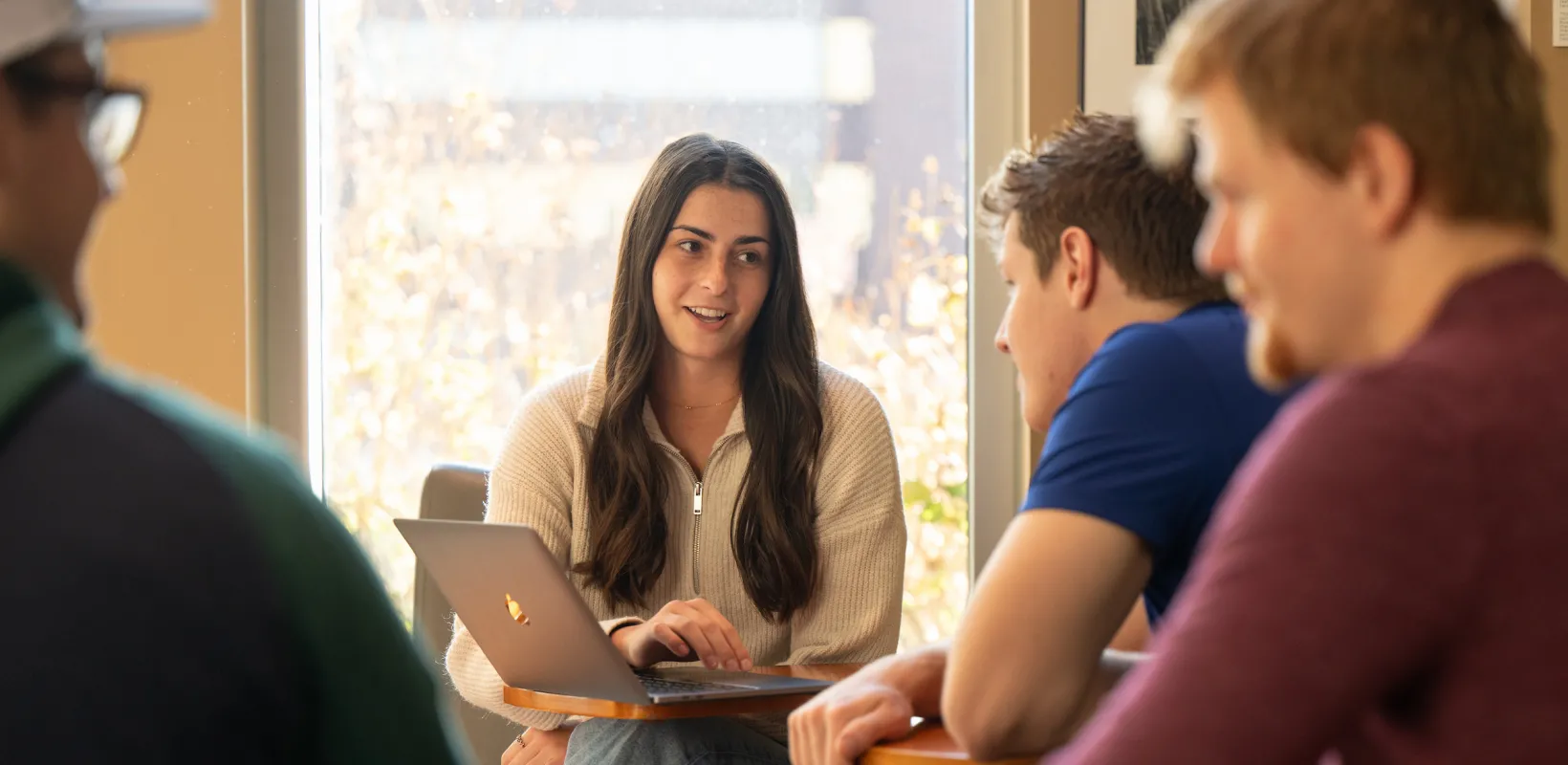 students discussing a class project