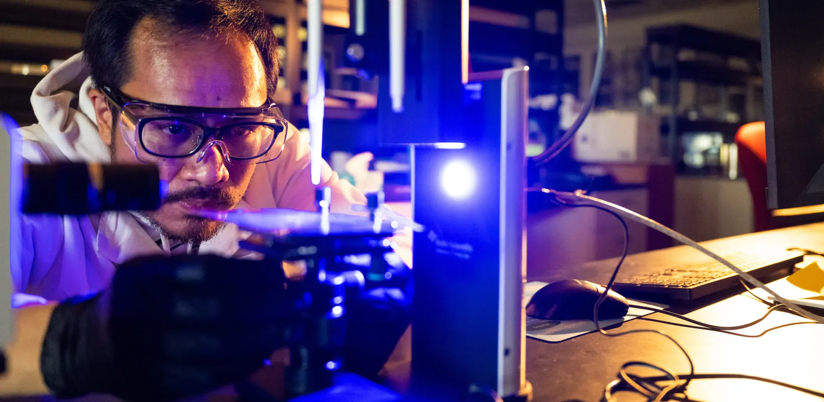 researcher using lab equipment in Coatings & Polymers