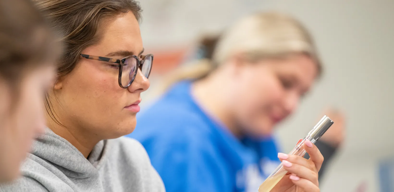 students looking at samples in a lab