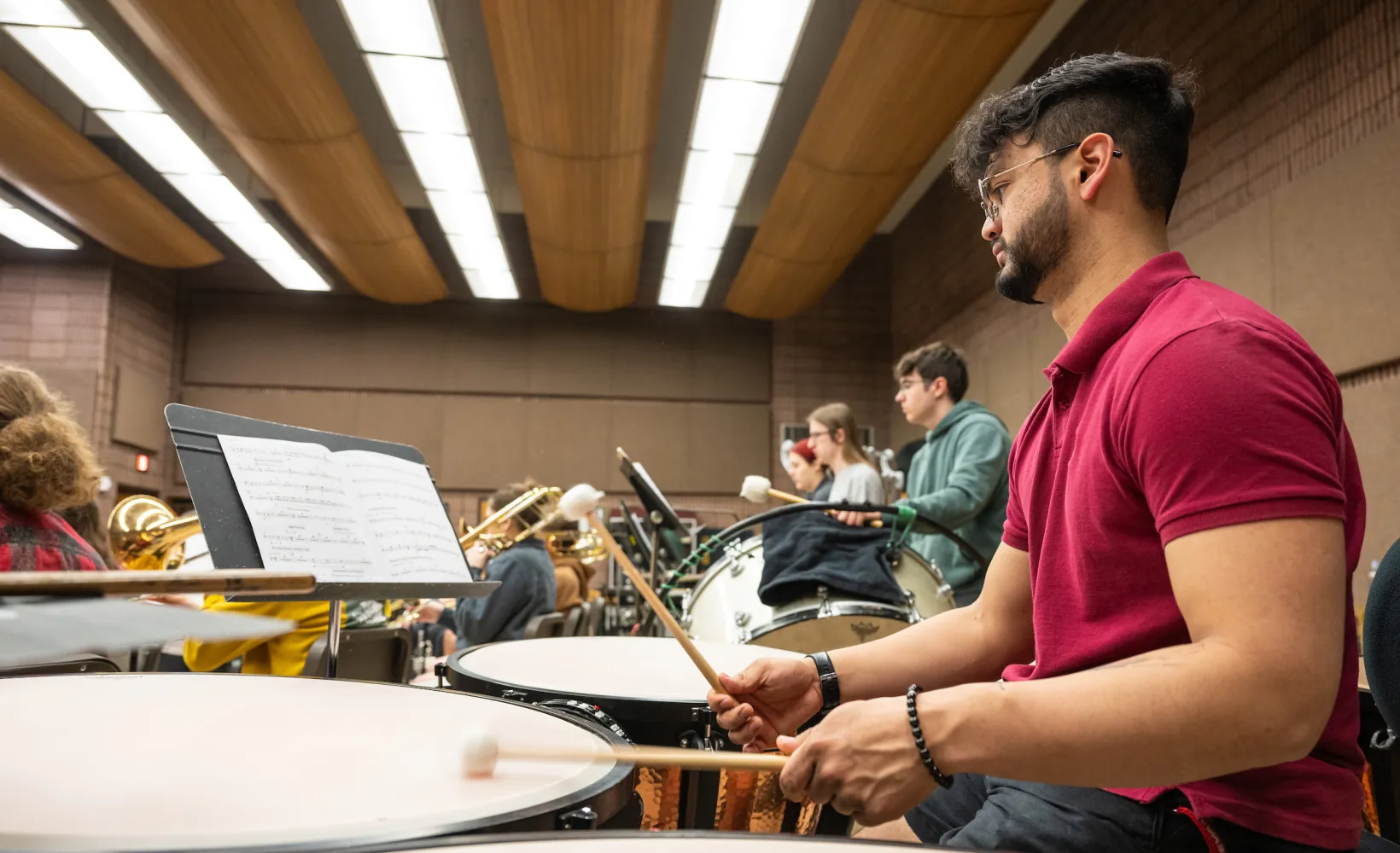 students in the percussion section practicing