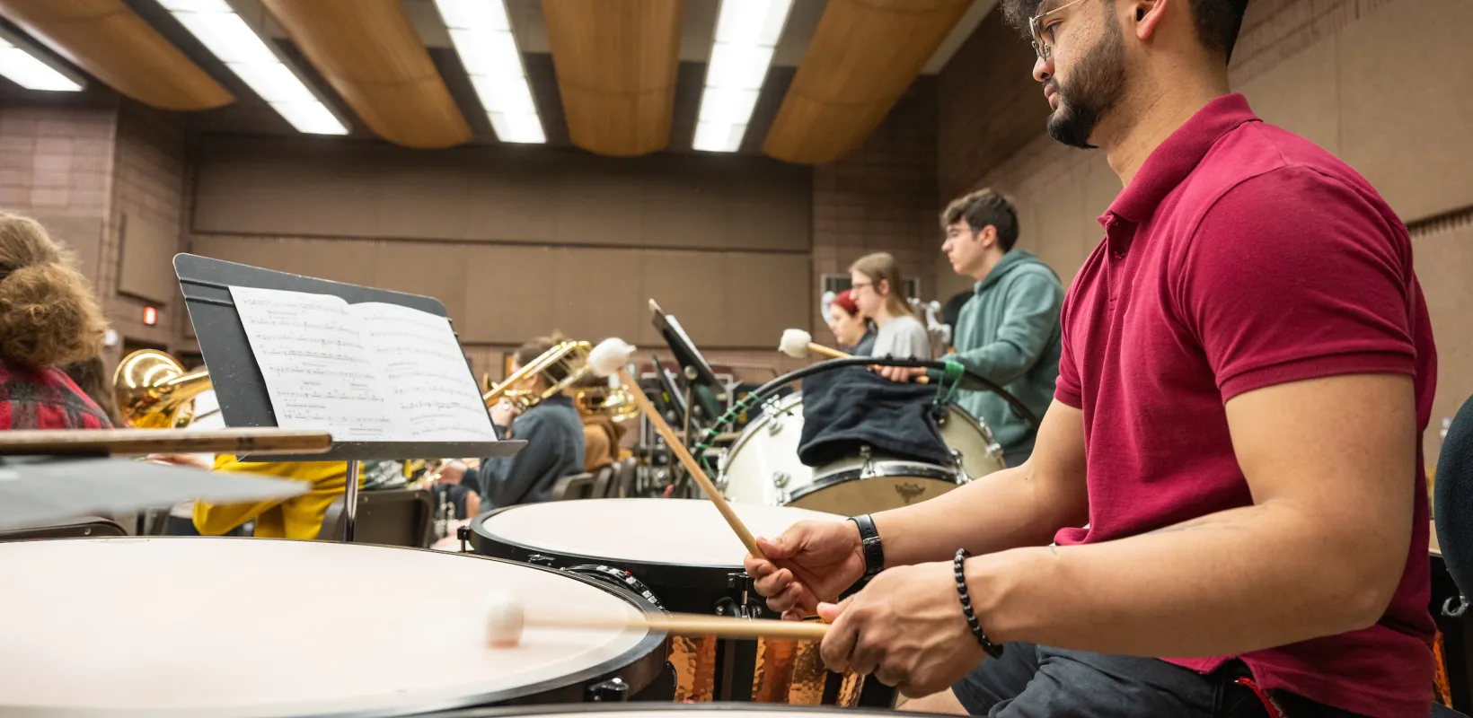 students in the percussion section practicing