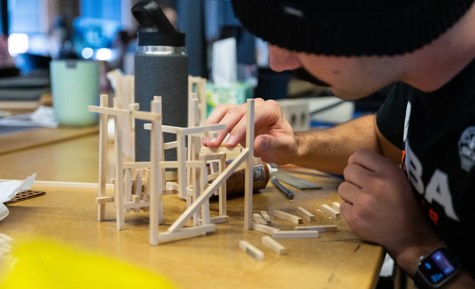 student building an architectural model