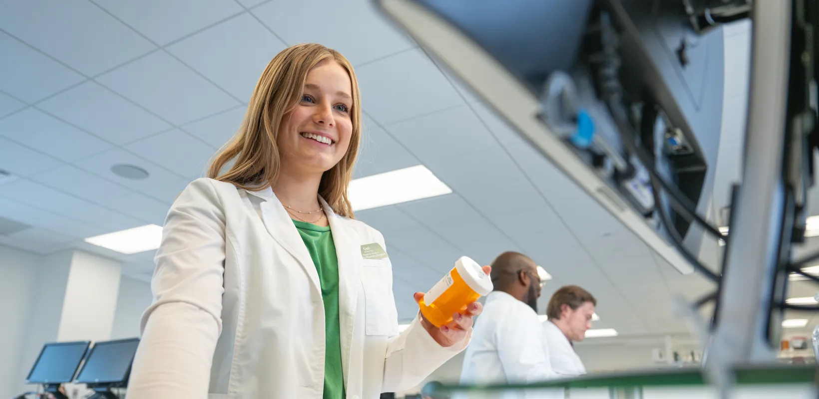Pharmacy student filling a prescription