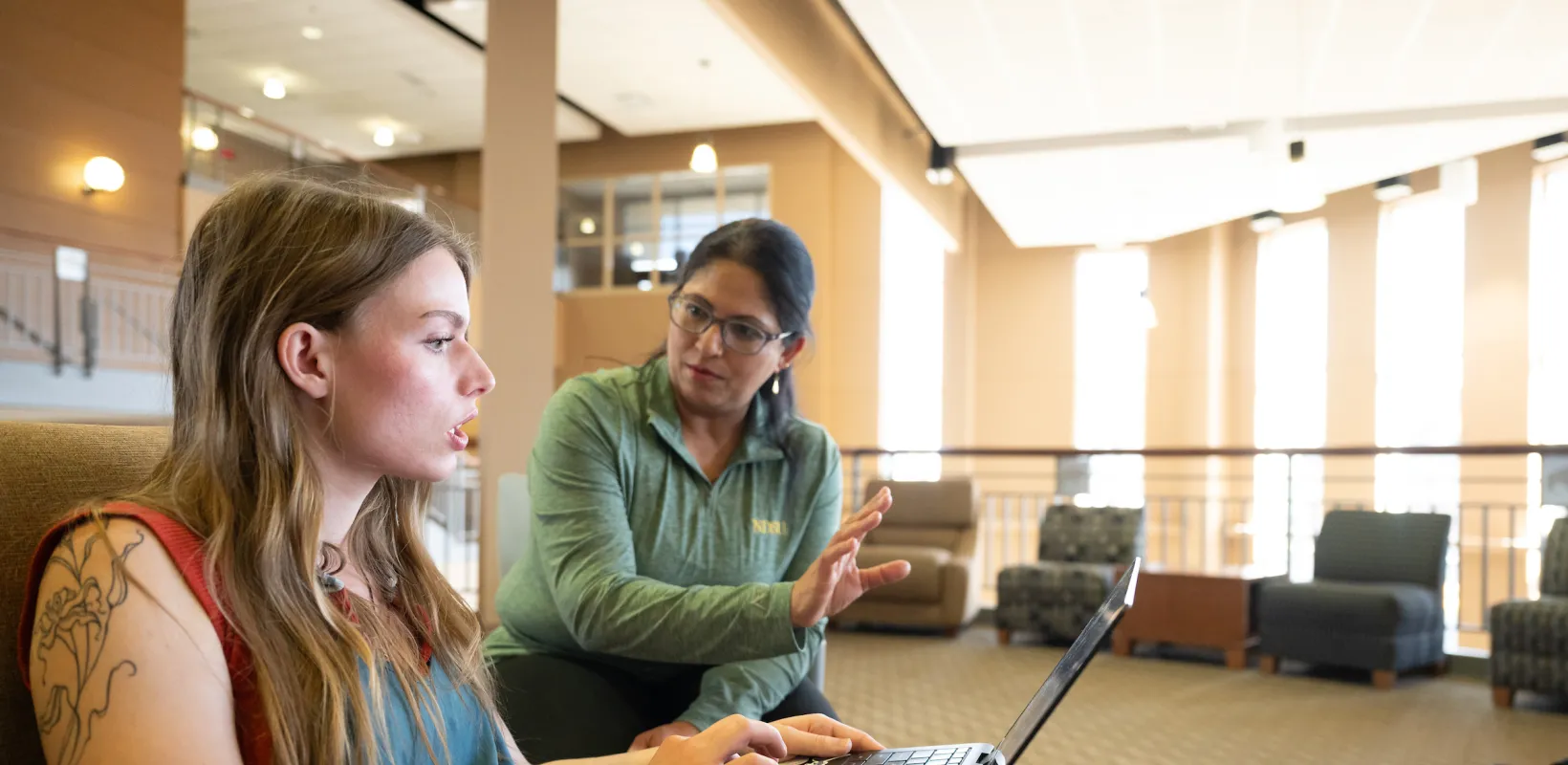 professor explaining a topic to a student