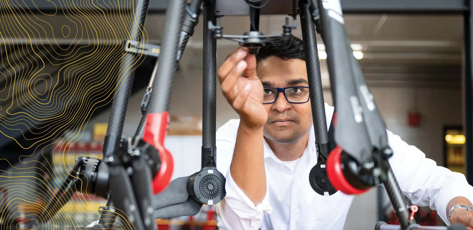 student in Precision Agriculture working on a drone