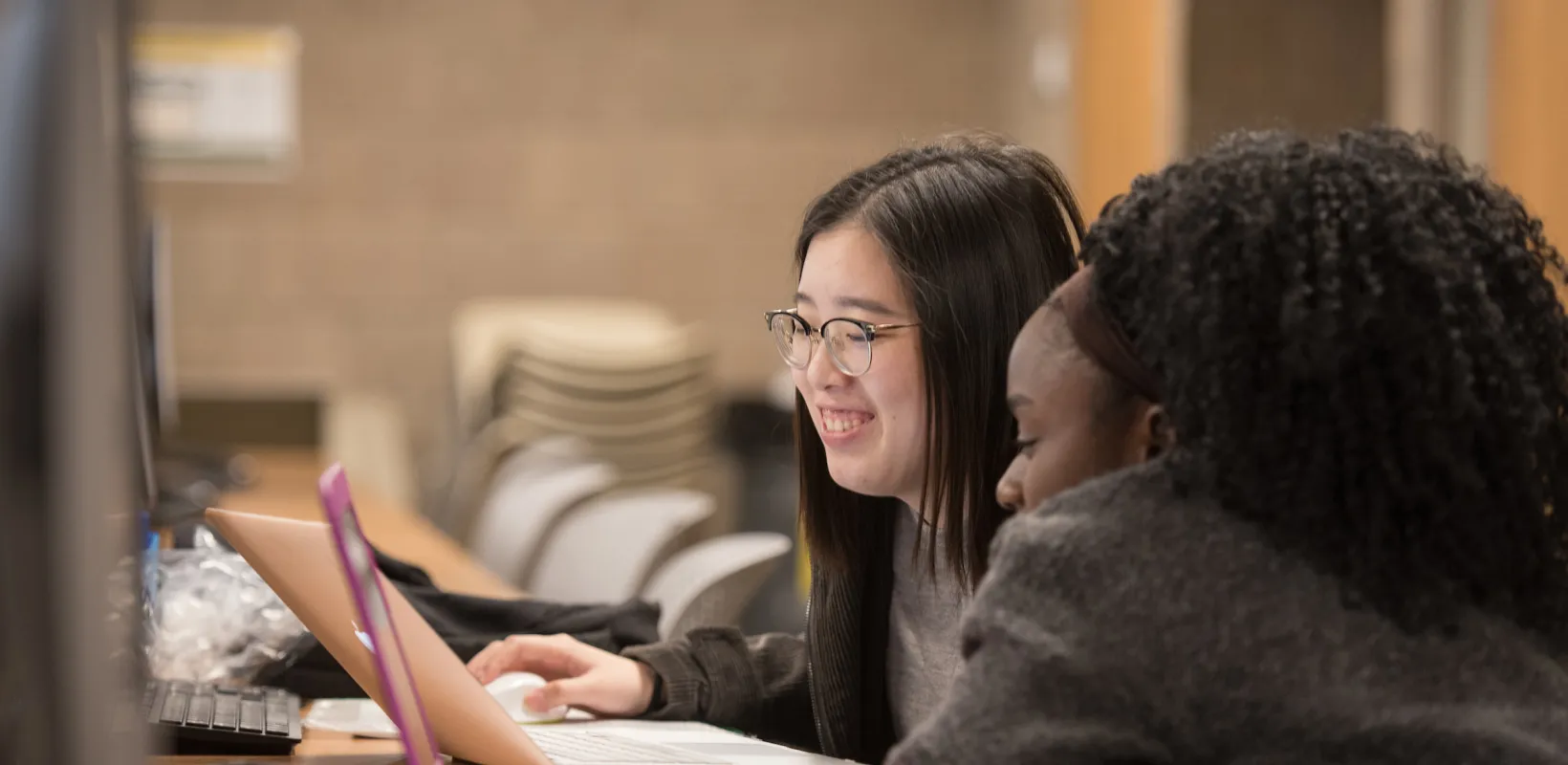 students looking at a laptop screen