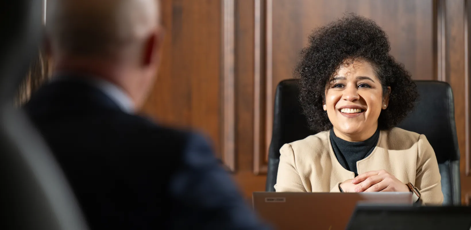 grad student visiting with business professional