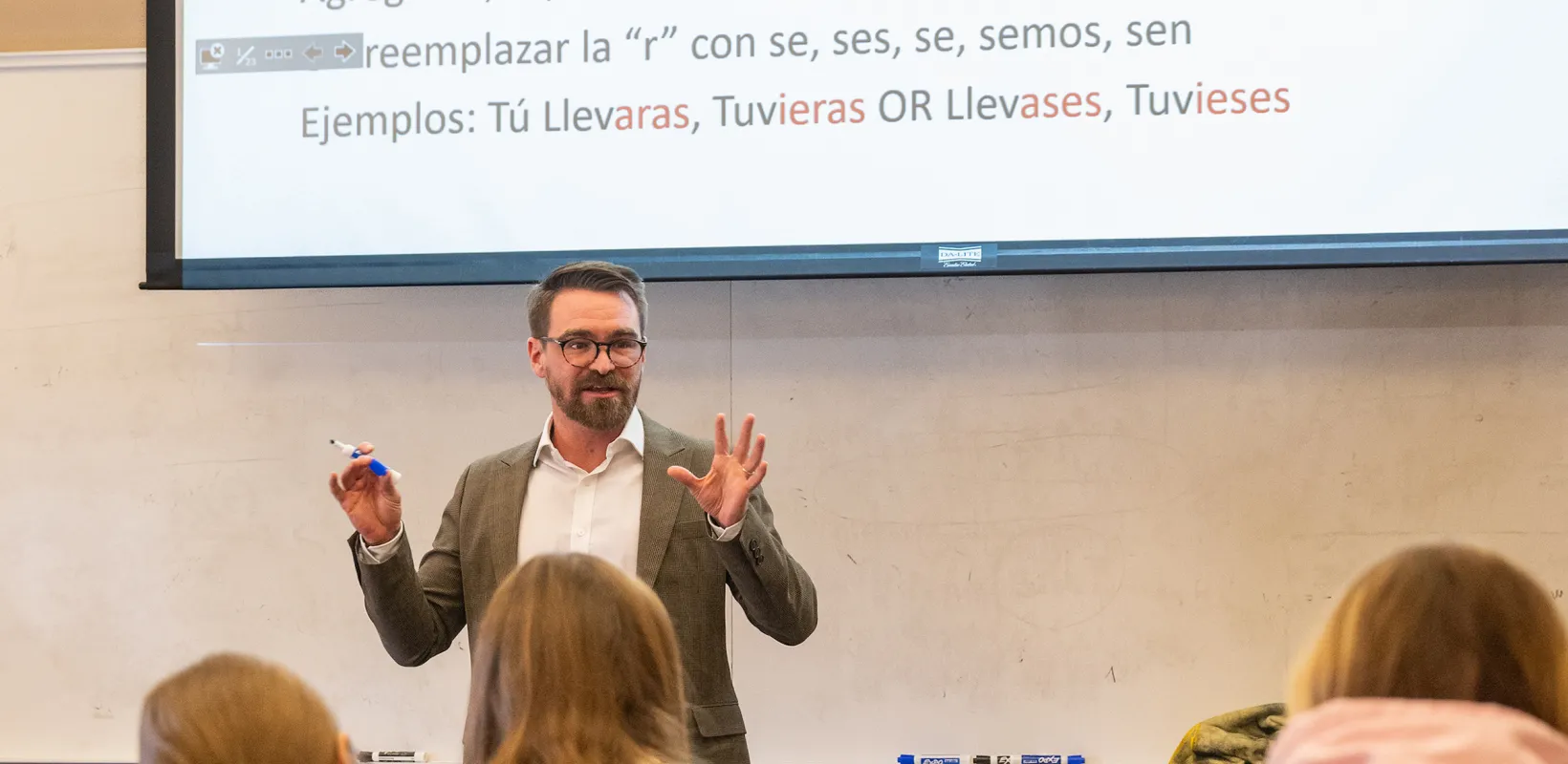 professor lecturing to students during Spanish class