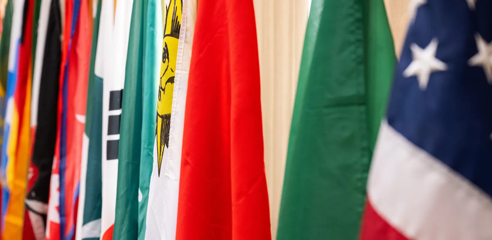 close up of various flags representing many countries