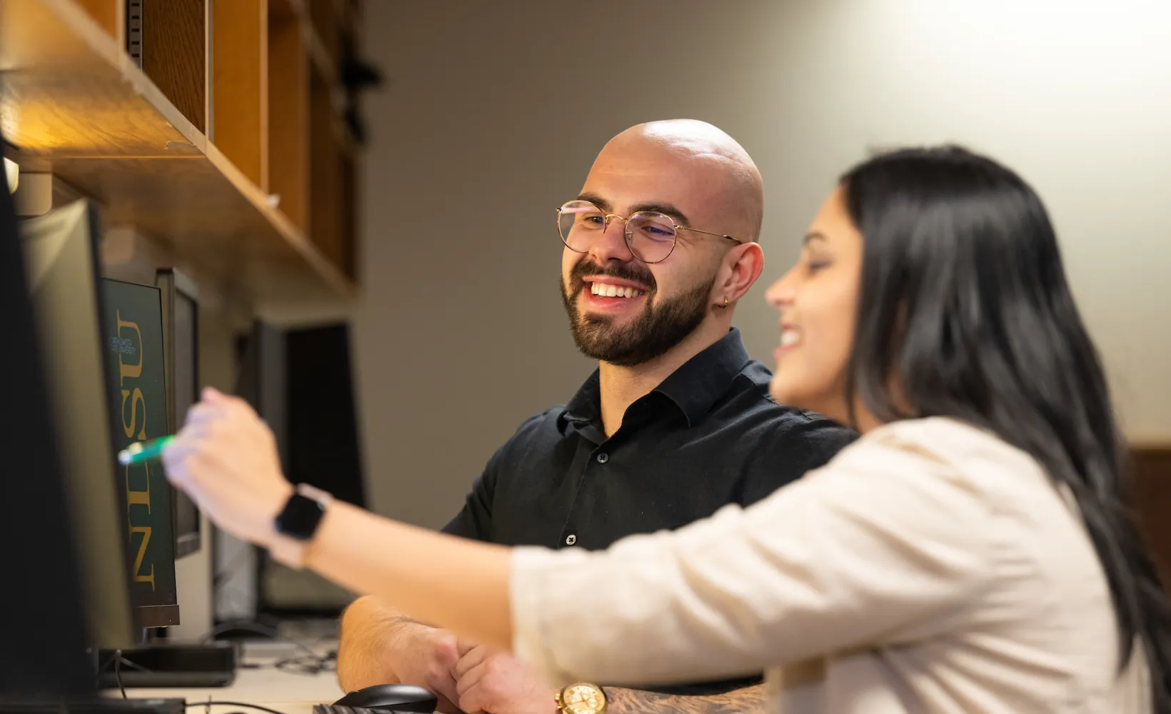 students working together at the Grad Hub in the Library