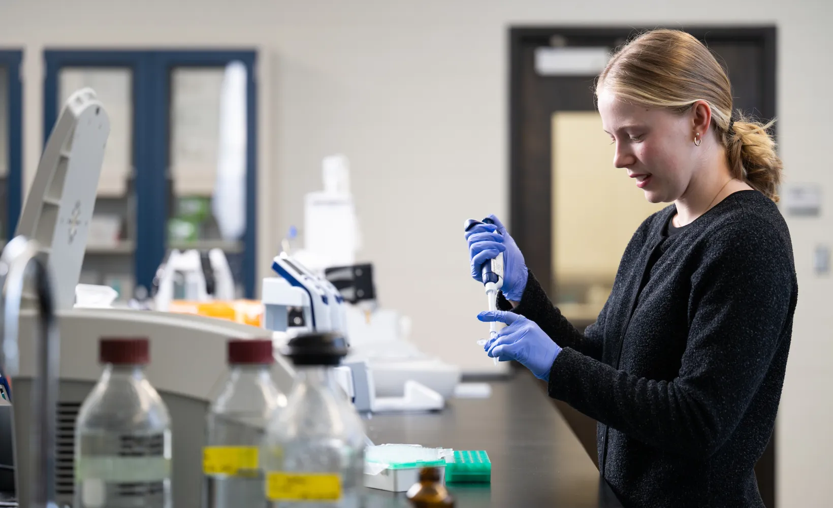 student working with sample in lab