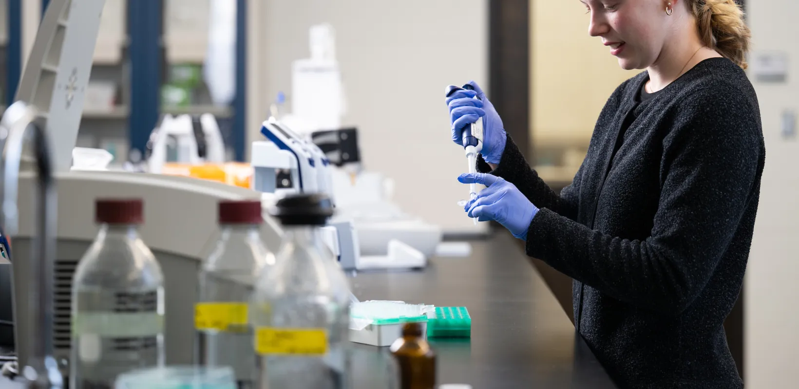 student working with sample in lab