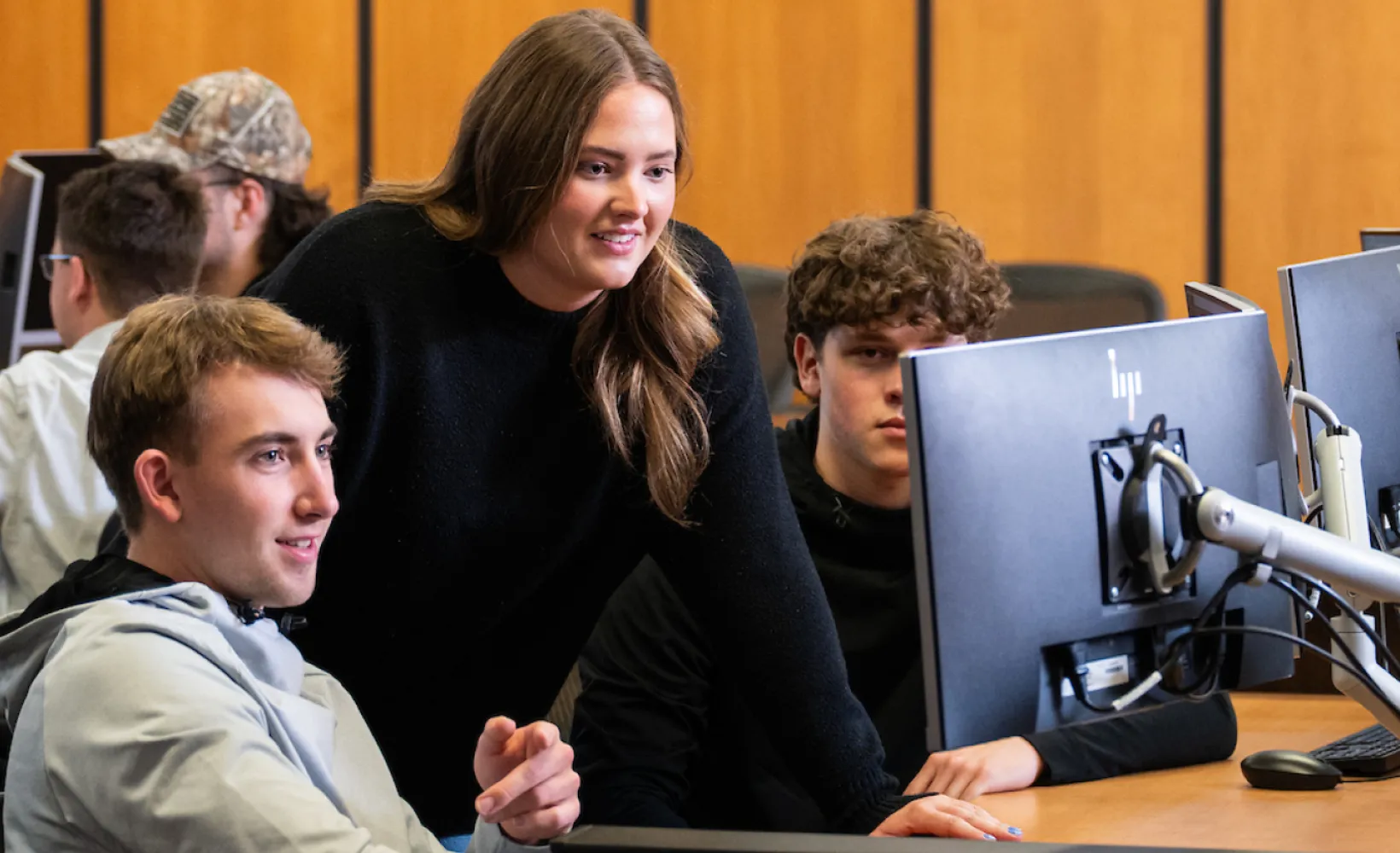 Students looking at computer
