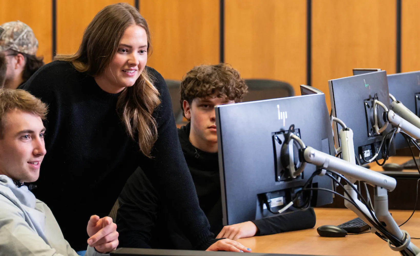 Students looking at computer
