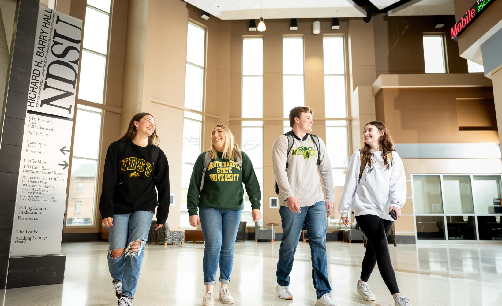 Students walking inside Barry Hall.