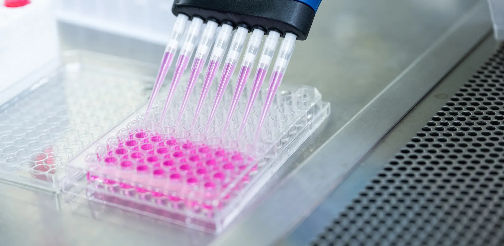 student filling vials for testing