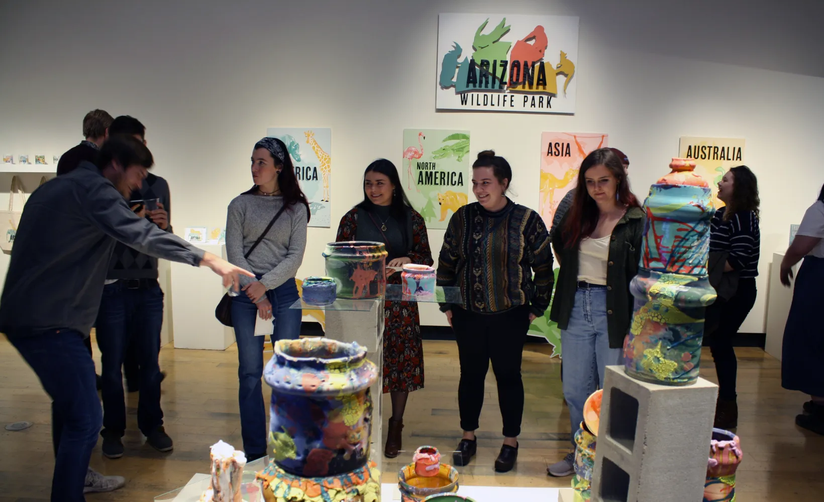 Visitors view ceramic artworks at the MU Gallery. 