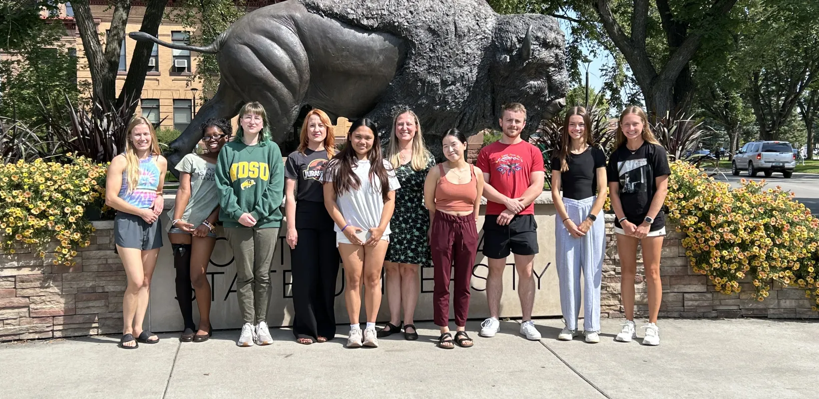 Picture of the SPANH Lab in front of the NDSU Bison statue