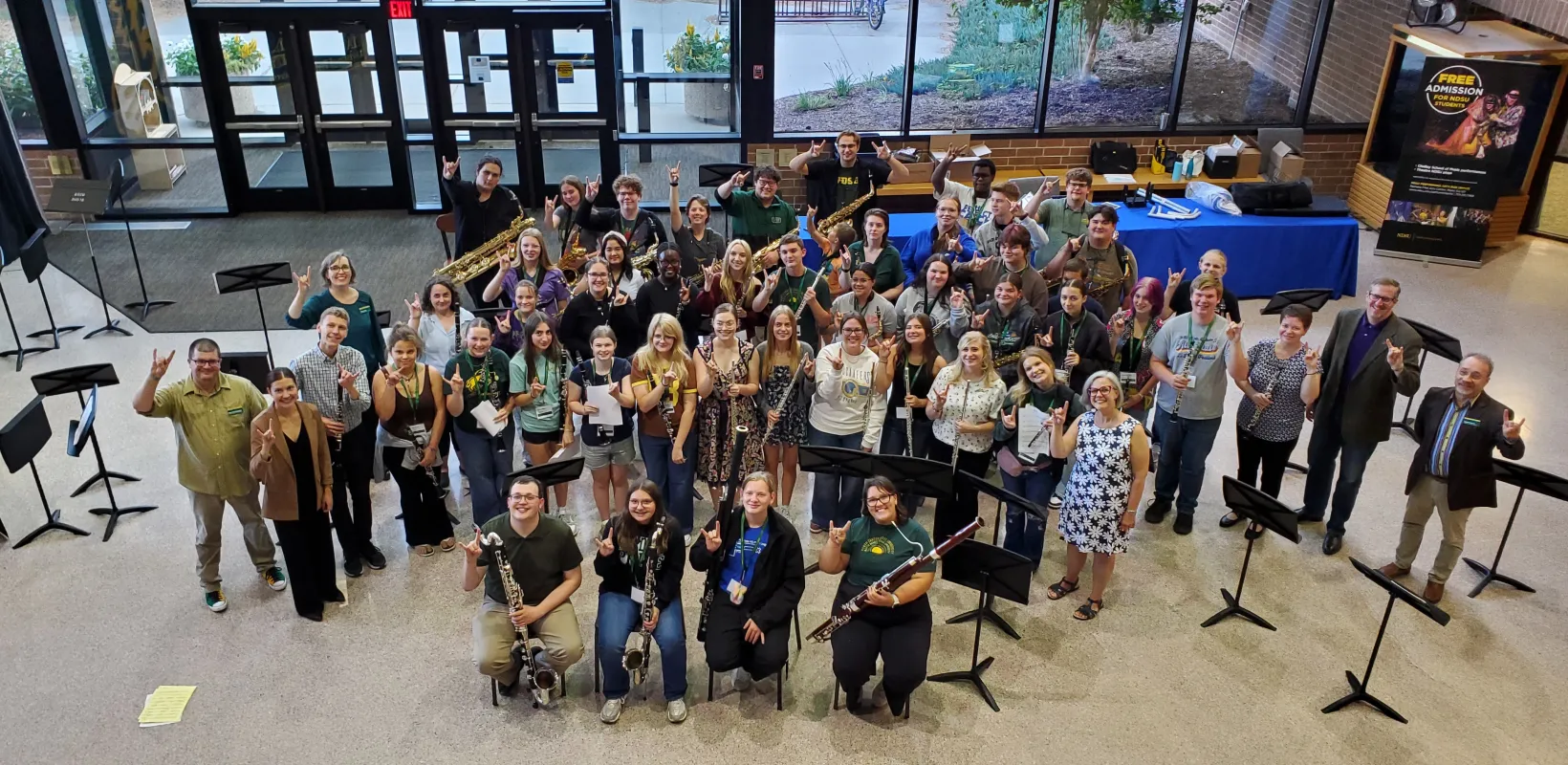A group of high school students, NDSU students, NDSU faculty, and guest artists pose for a group shot at the 2025 NDSU Woodwind Day.