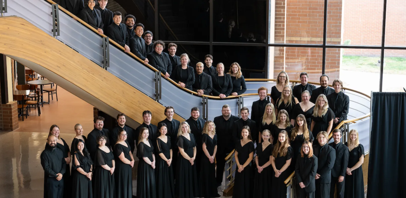 The NDSU Concert Choir standing on a staircase