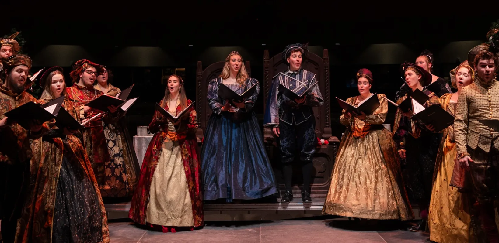 A group of students performing in NDSU's Madrigal Dinners.