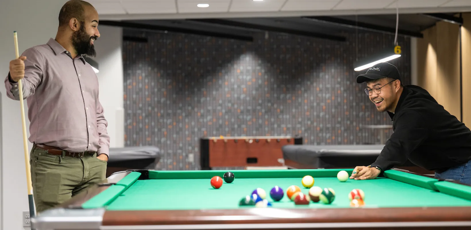 students playing billiards