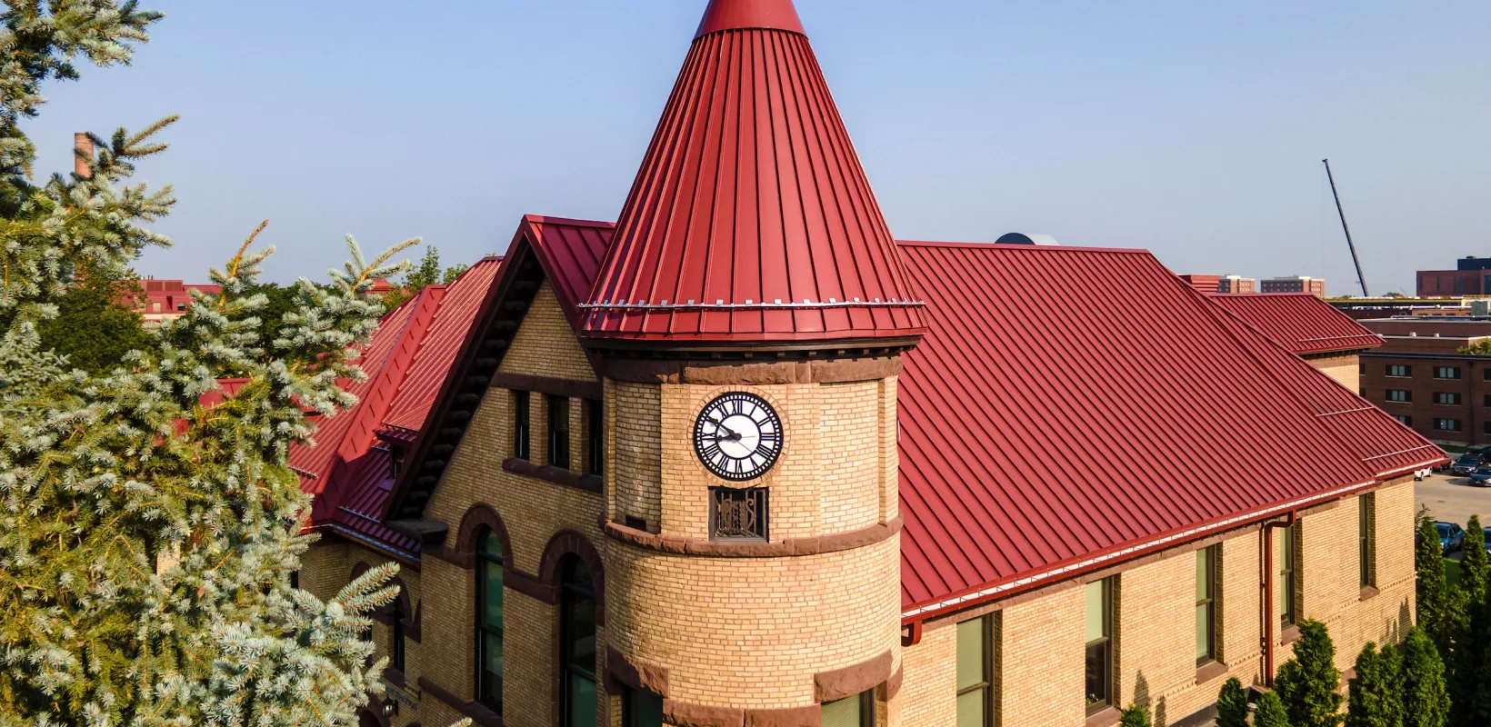 birds eye view of Old Main focusing on the clock tower and red roof