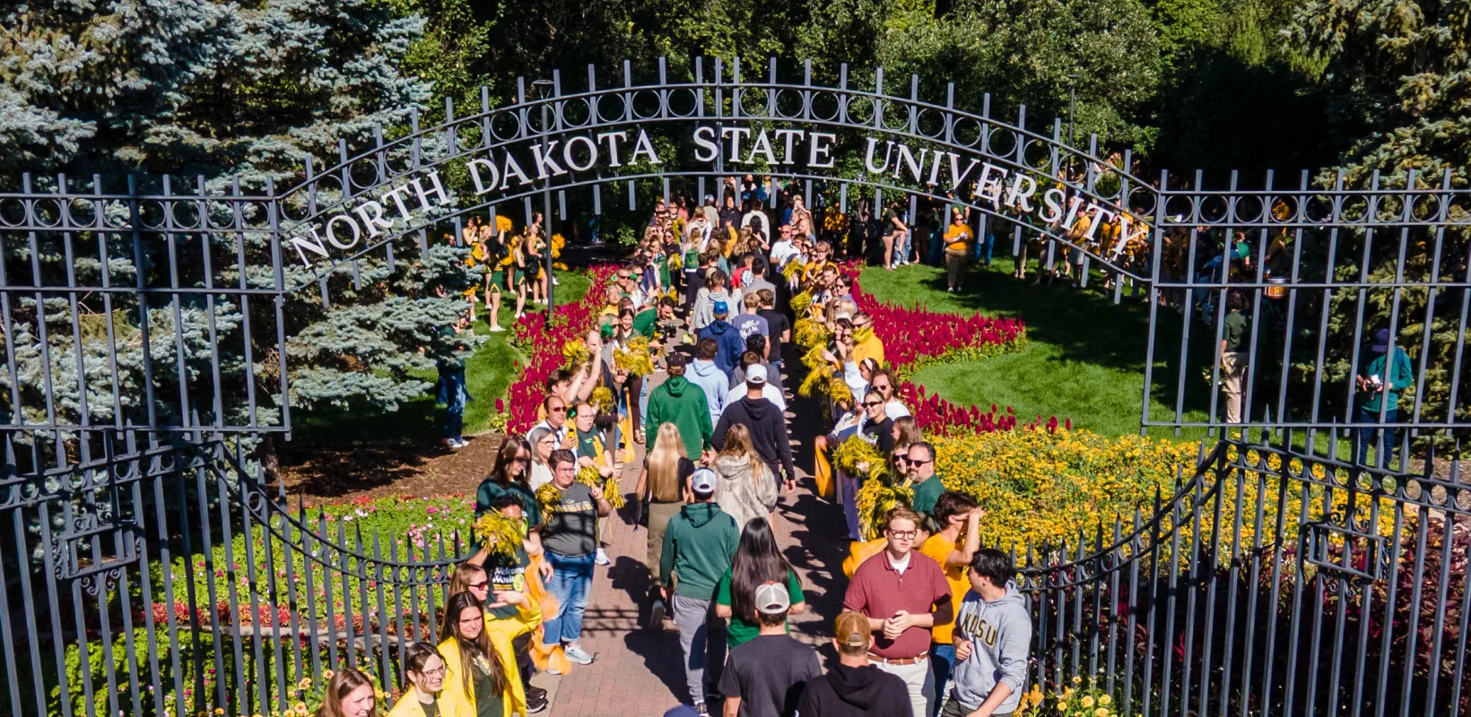 students walking through the NDSU gate on the first day of class