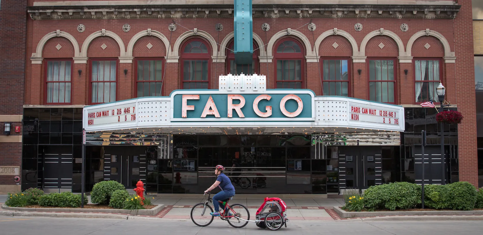 fargo theatre marquee with biker in front