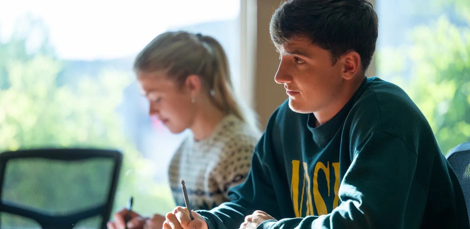 Two students studying in class. 
