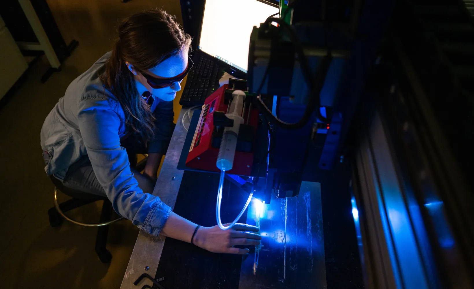 student working with a 3D printer