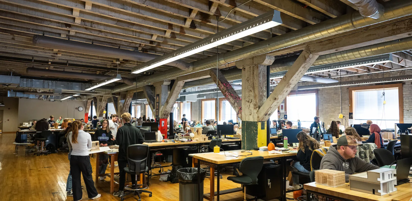 Students working in the large open design studio at NDSU.
